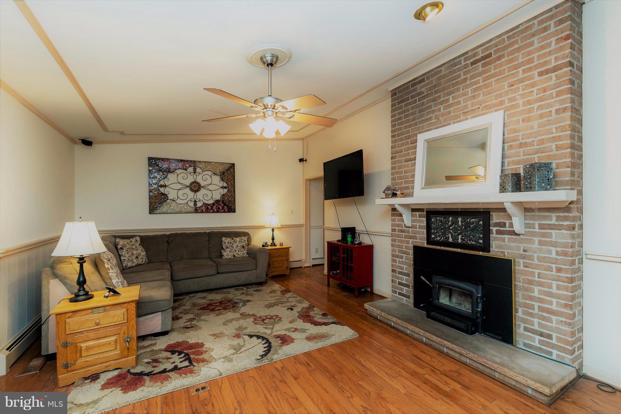 3 Stonehurst Road Phoenix, MD 21131 - Photo 11 of 30 Family room with second fireplace and large mantle
