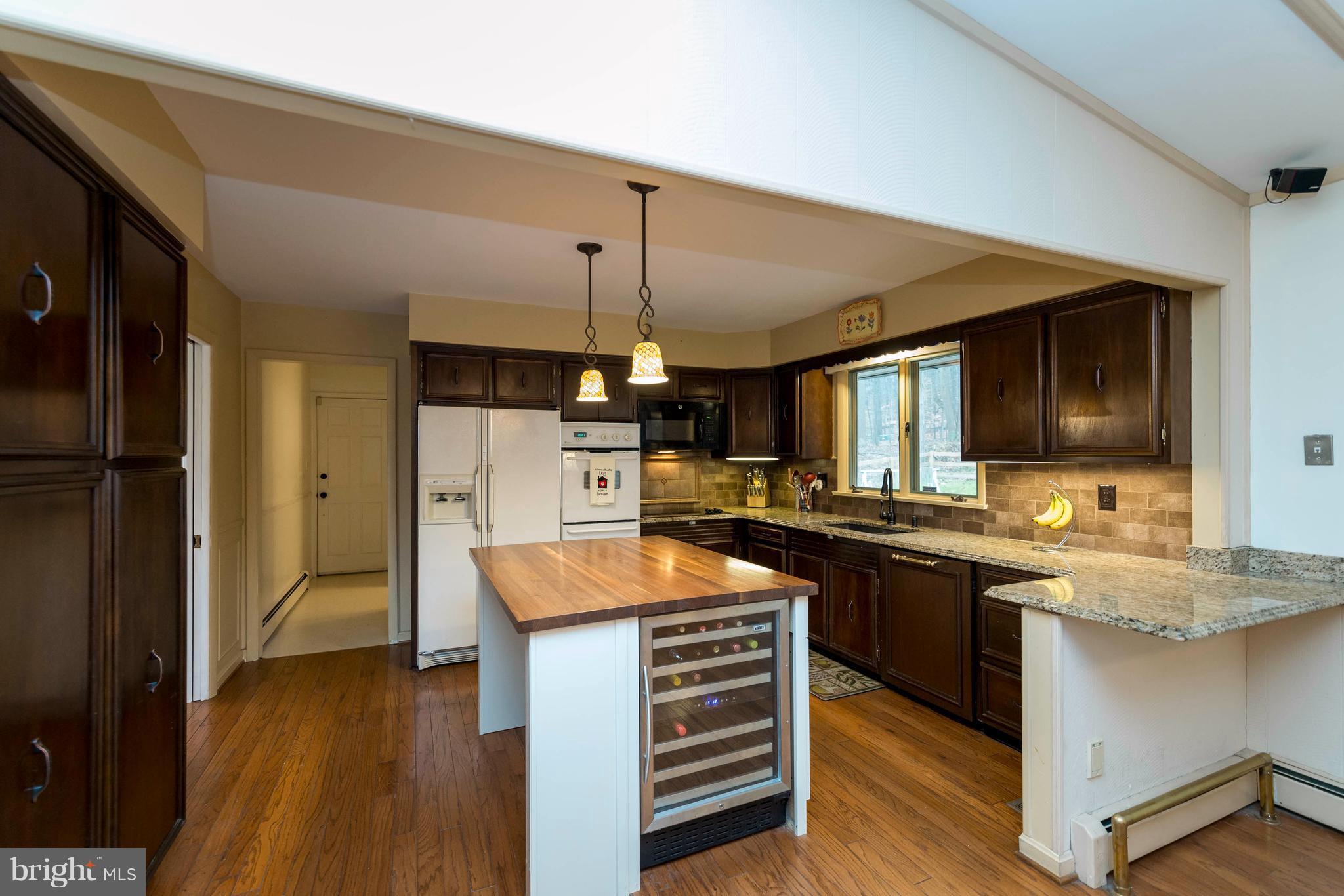 3 Stonehurst Road Phoenix, MD 21131 - Photo 9 of 30 Island w/ butcher block countertop and wine fridge