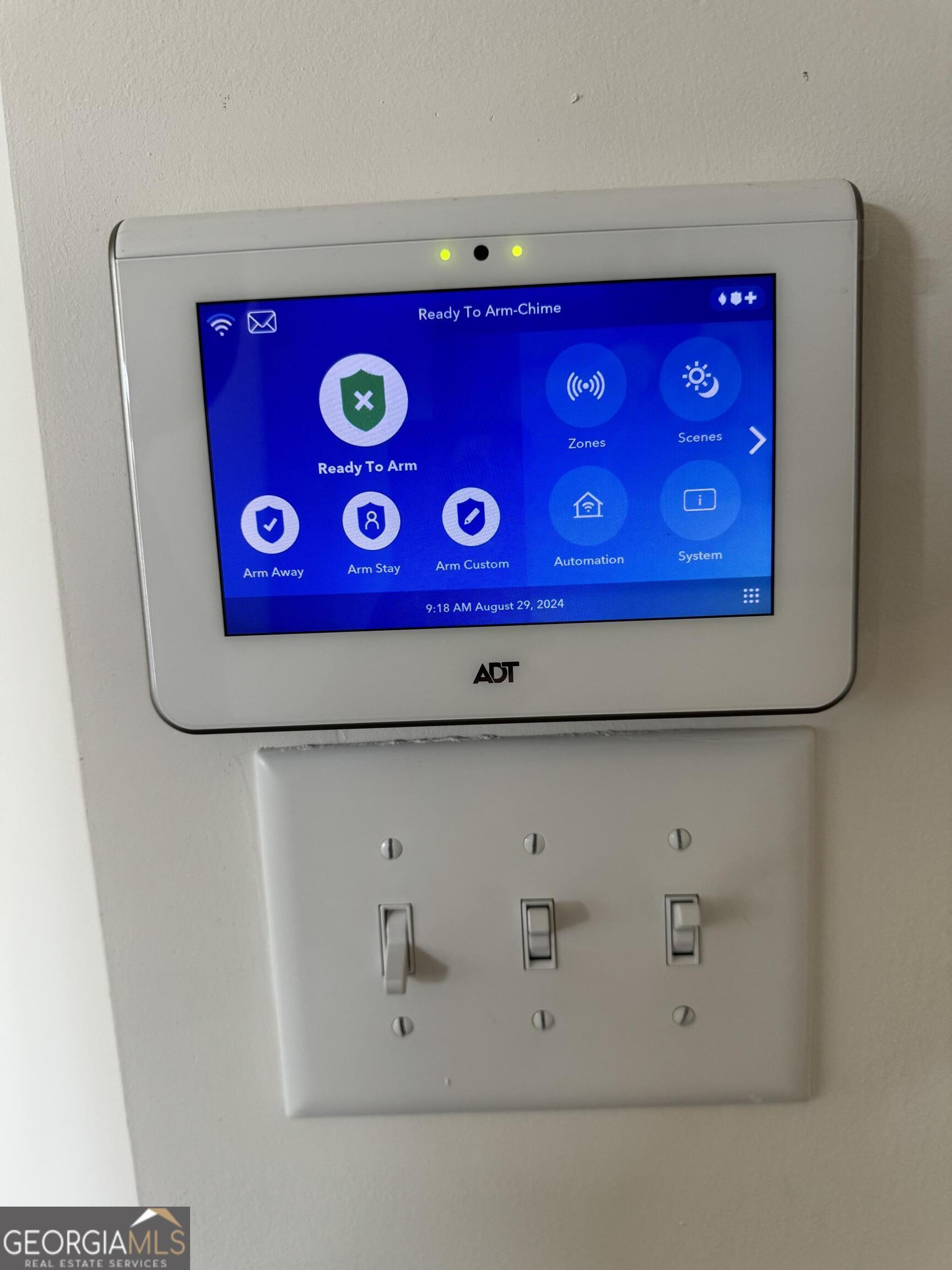 844 Venture Way Atlanta, GA 30331 - Photo 5 of 37 a view of a kitchen with red wall and white countertops