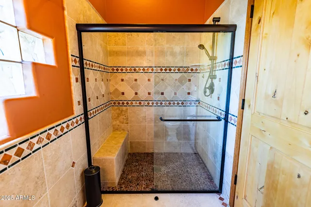 a view of a kitchen with a sink and wooden floor