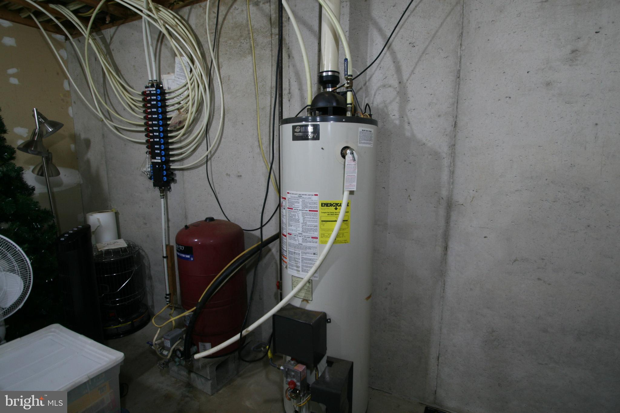 21427 Shore Valley Road Three Springs, PA 17264 - Photo 38 of 39 Pex tubing and propane water heater