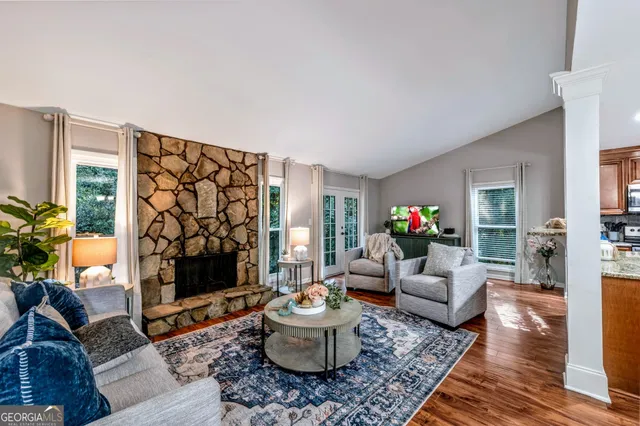 a living room with furniture and a fireplace