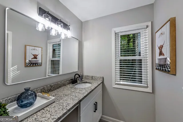 a bathroom with a toilet and a shower curtain