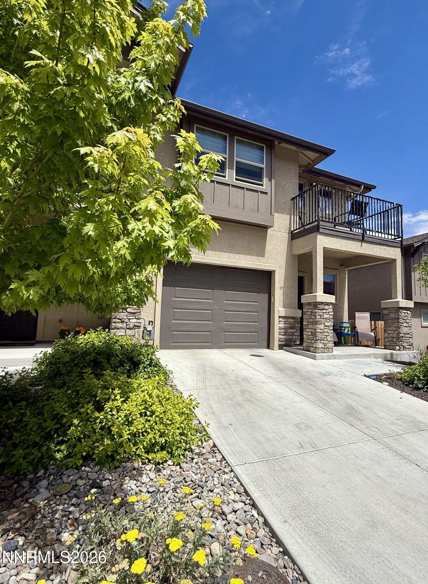 1310 Handelin Road Carson City, NV 89706 - Photo 1 of 40 a front view of a house with a yard
