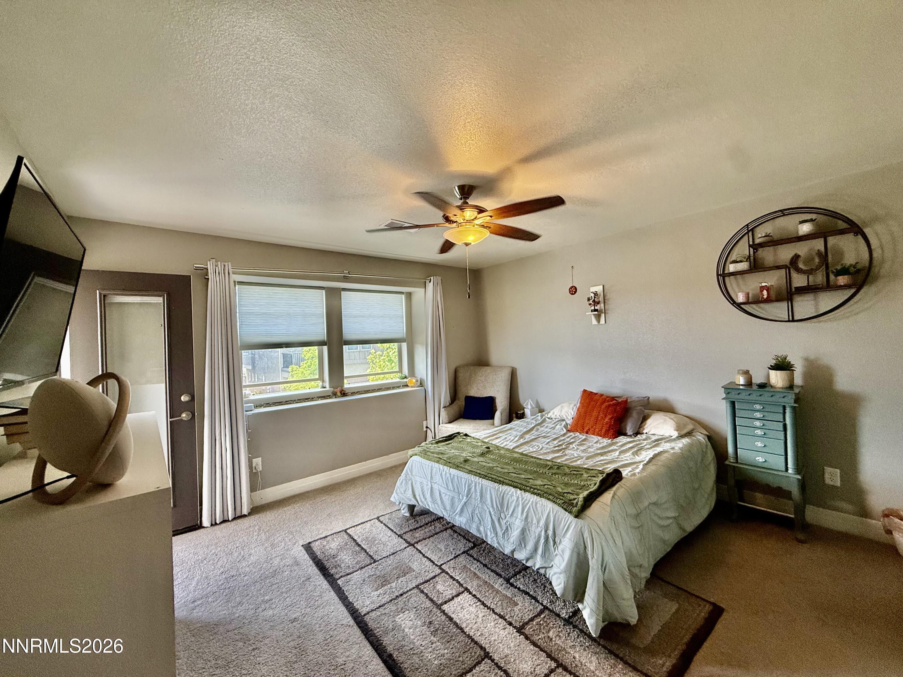 1310 Handelin Road Carson City, NV 89706 - Photo 19 of 40 a bedroom with a bed and window