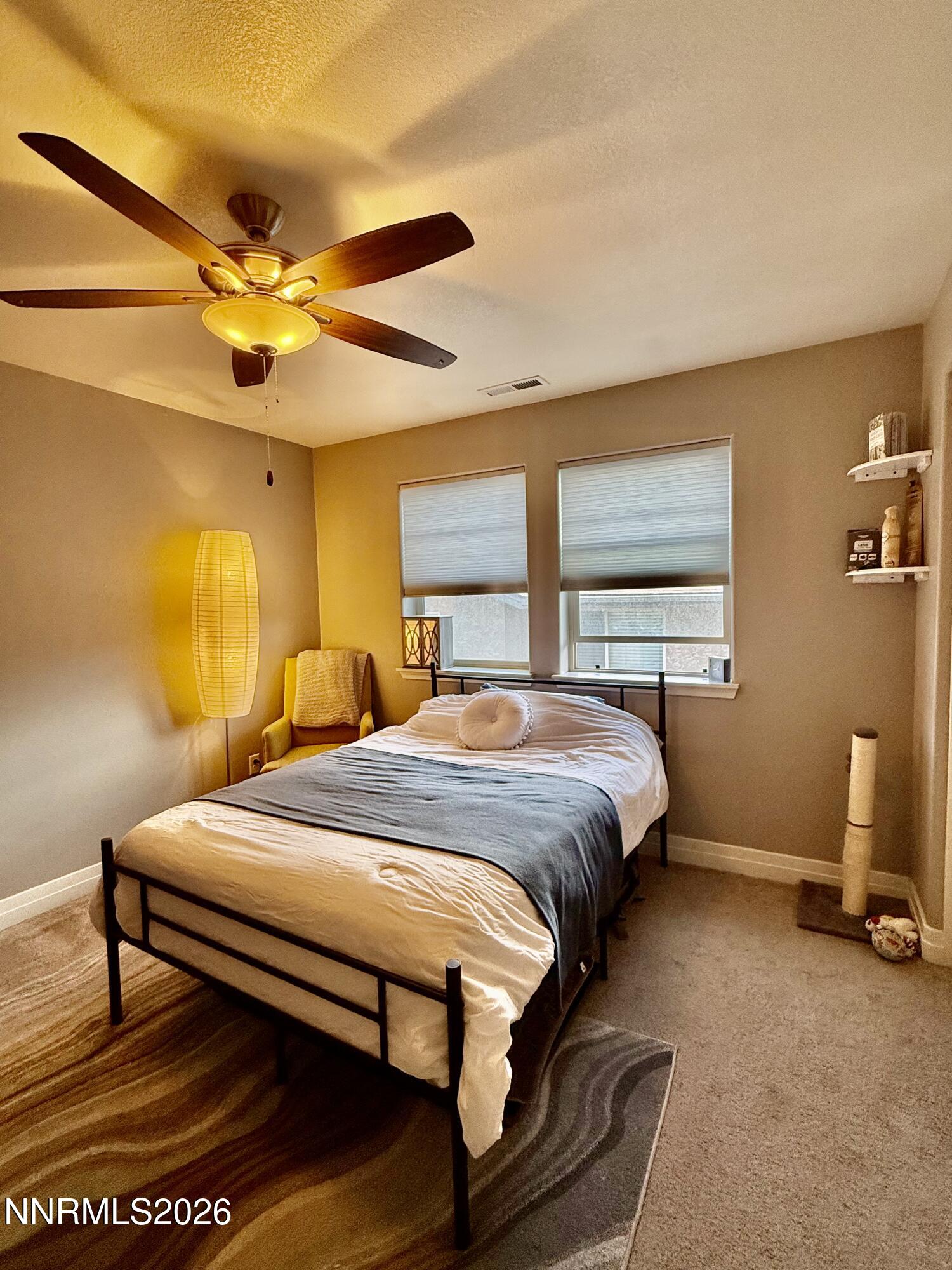 1310 Handelin Road Carson City, NV 89706 - Photo 25 of 40 a bedroom with a bed and a chandelier