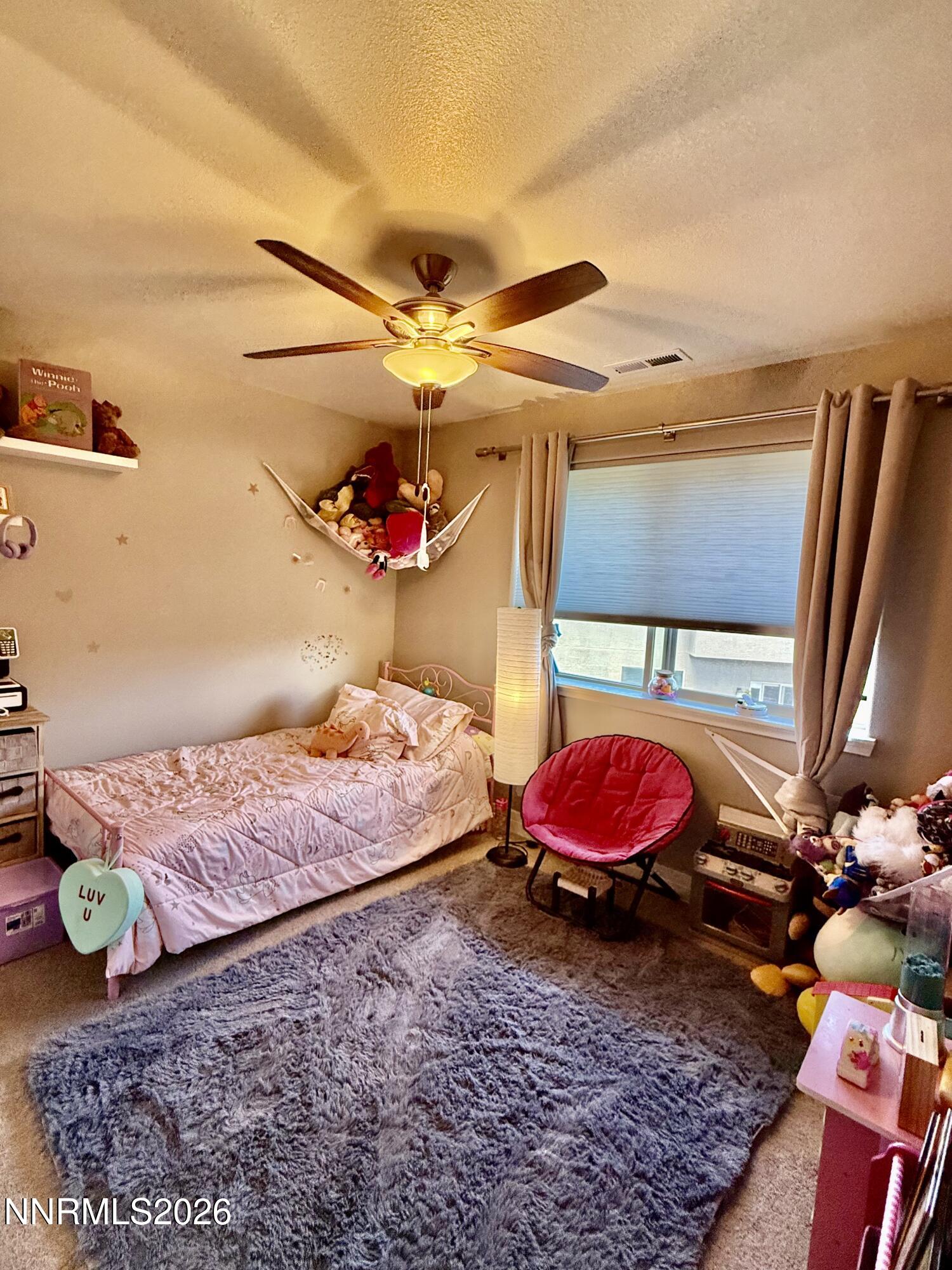 1310 Handelin Road Carson City, NV 89706 - Photo 27 of 40 a bed room with a bed and a couch