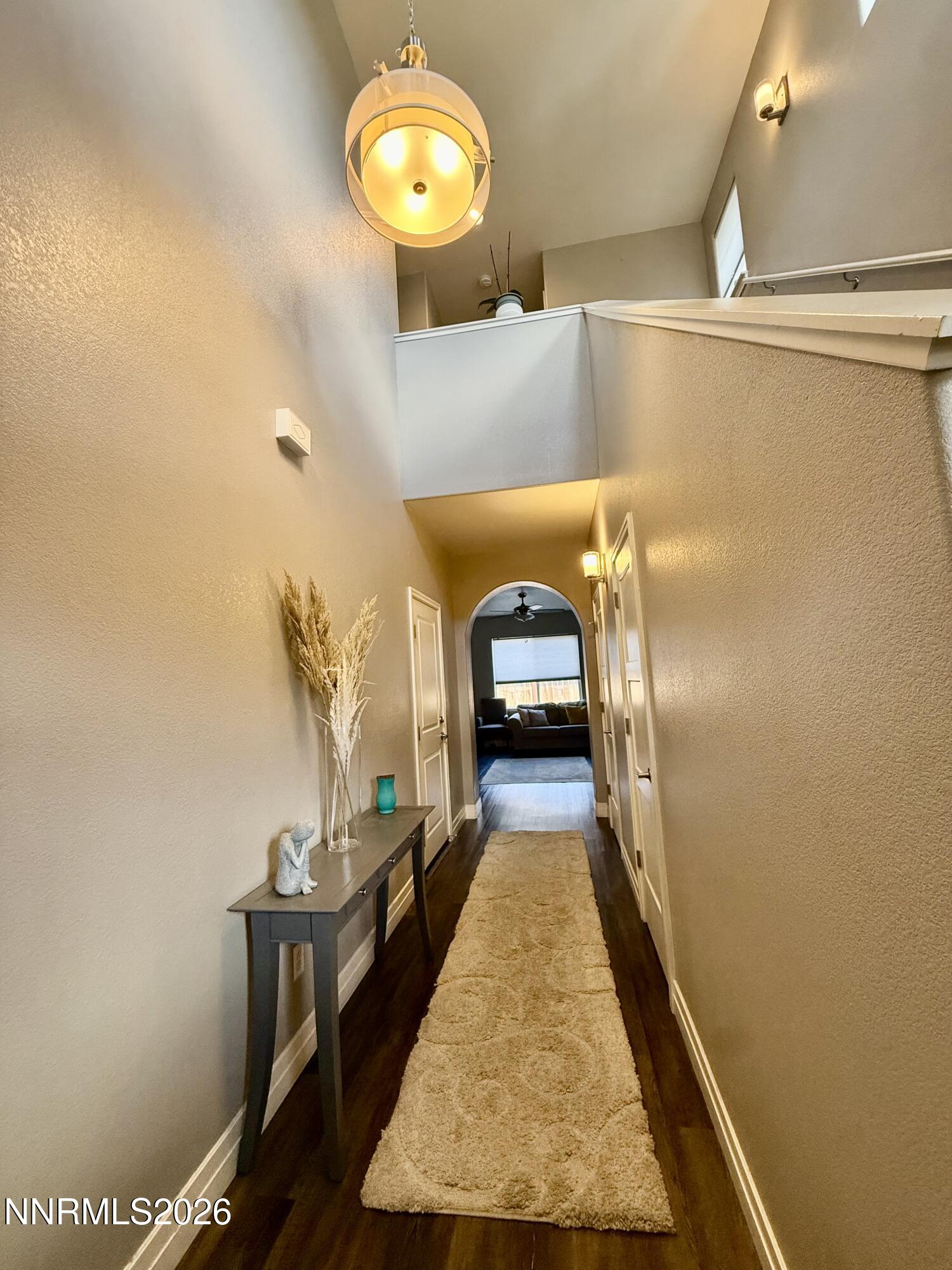 1310 Handelin Road Carson City, NV 89706 - Photo 7 of 40 a view of a hallway with wooden floor