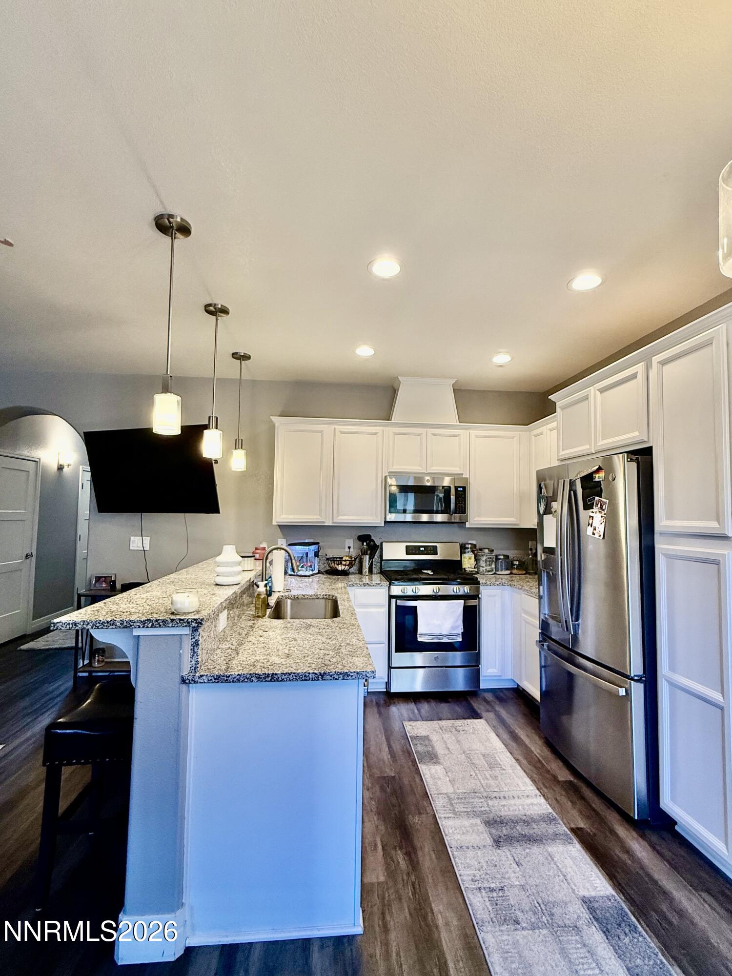 1310 Handelin Road Carson City, NV 89706 - Photo 10 of 40 a kitchen with a refrigerator a stove a sink and a oven