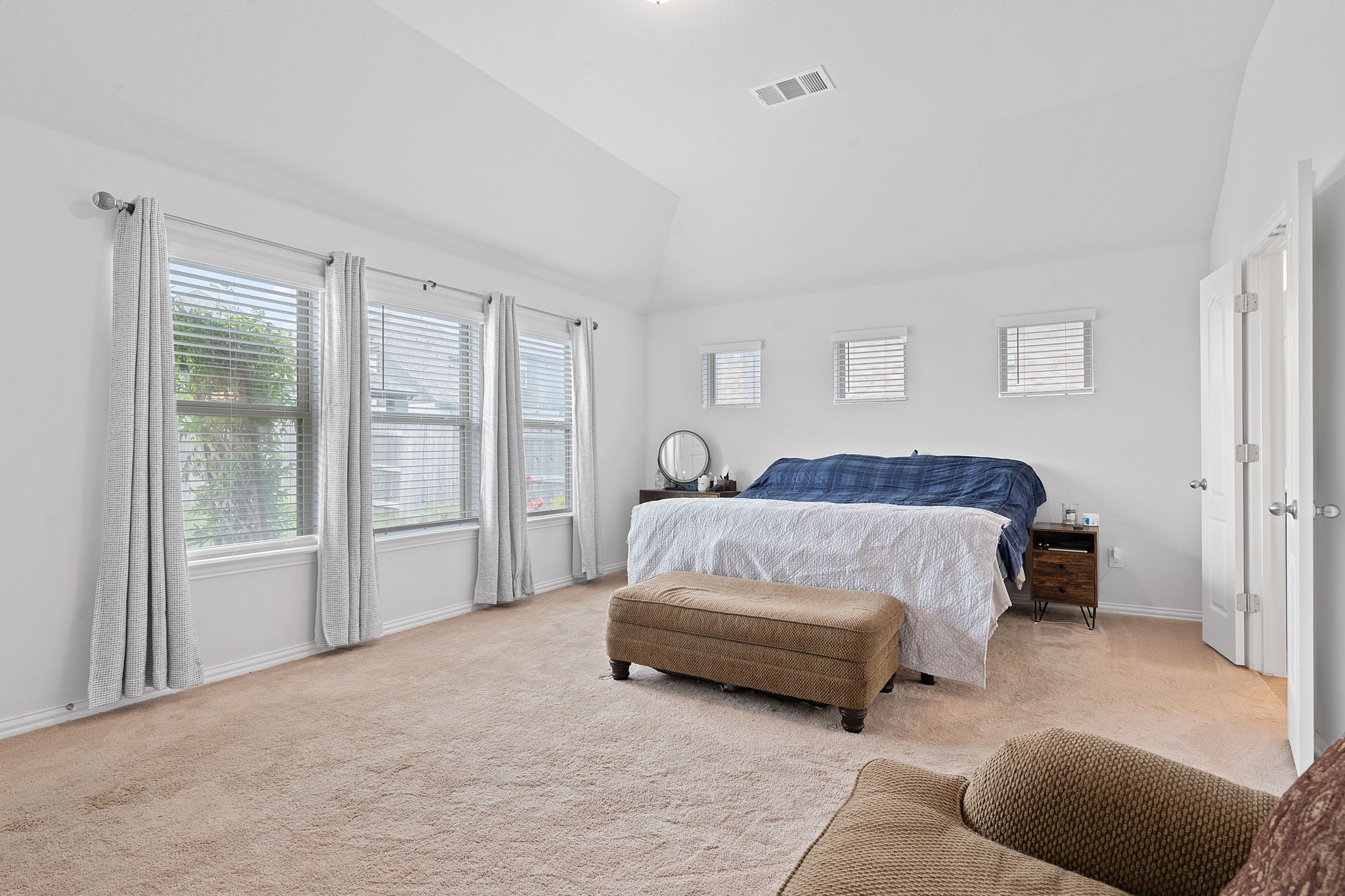 213 Treasure Trove Path Kyle, TX 78640 - Photo 19 of 29 Bedroom featuring vaulted ceiling and carpet floors
