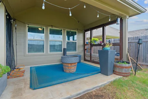 a outdoor living space with furniture and a potted plant
