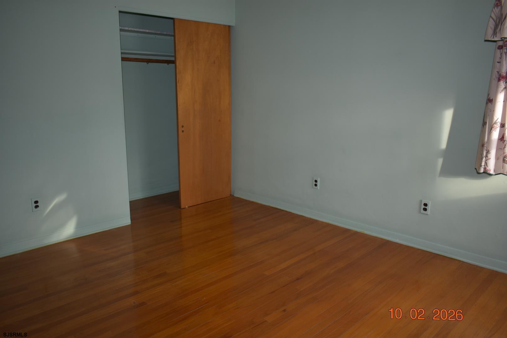 319 Barr Avenue Linwood, NJ 08221 - Photo 10 of 19 an empty room with wooden floor and closet