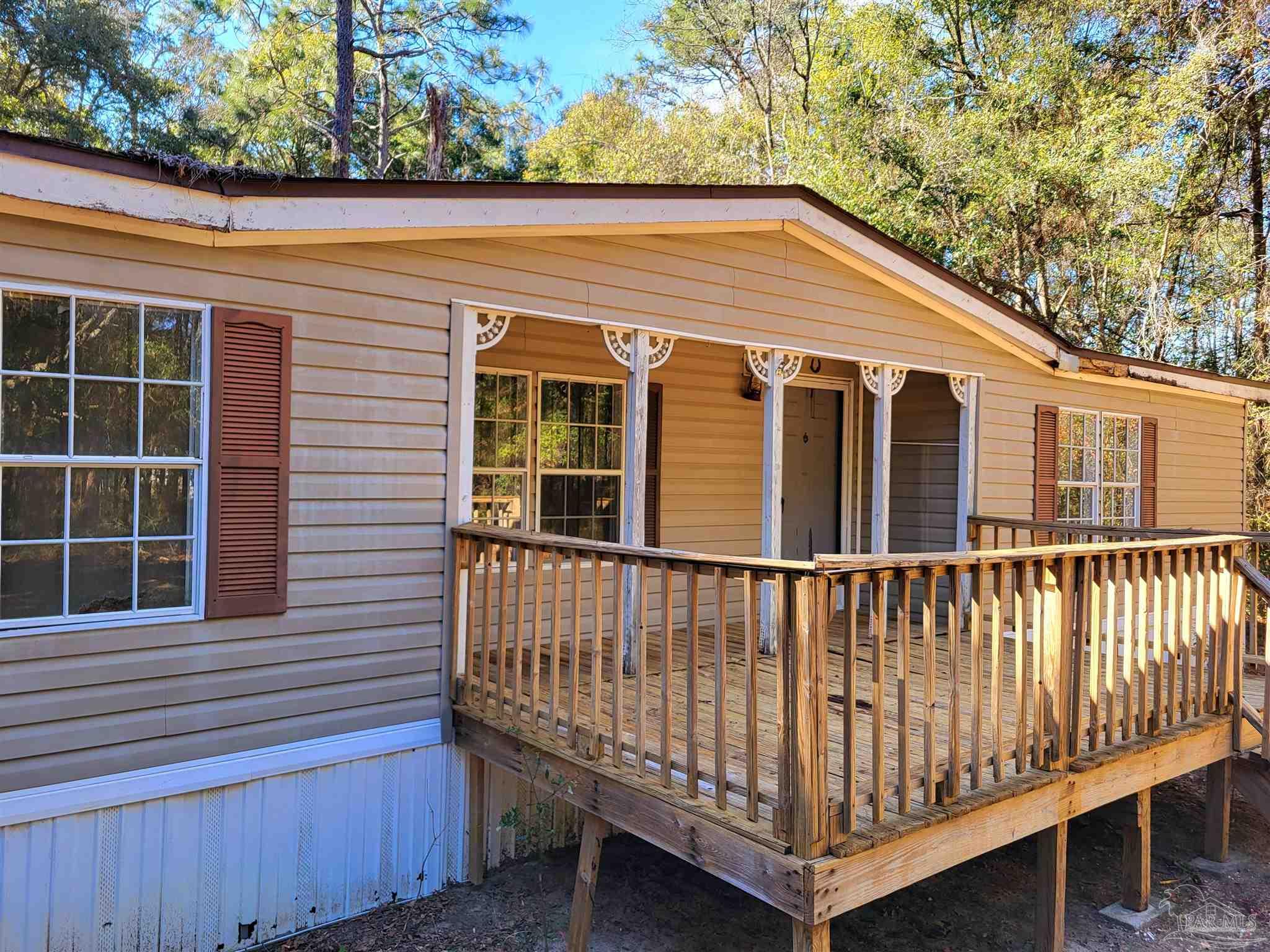 6337 Lynam Road Milton, FL 32570 - Photo 3 of 22 a view of a house with a window