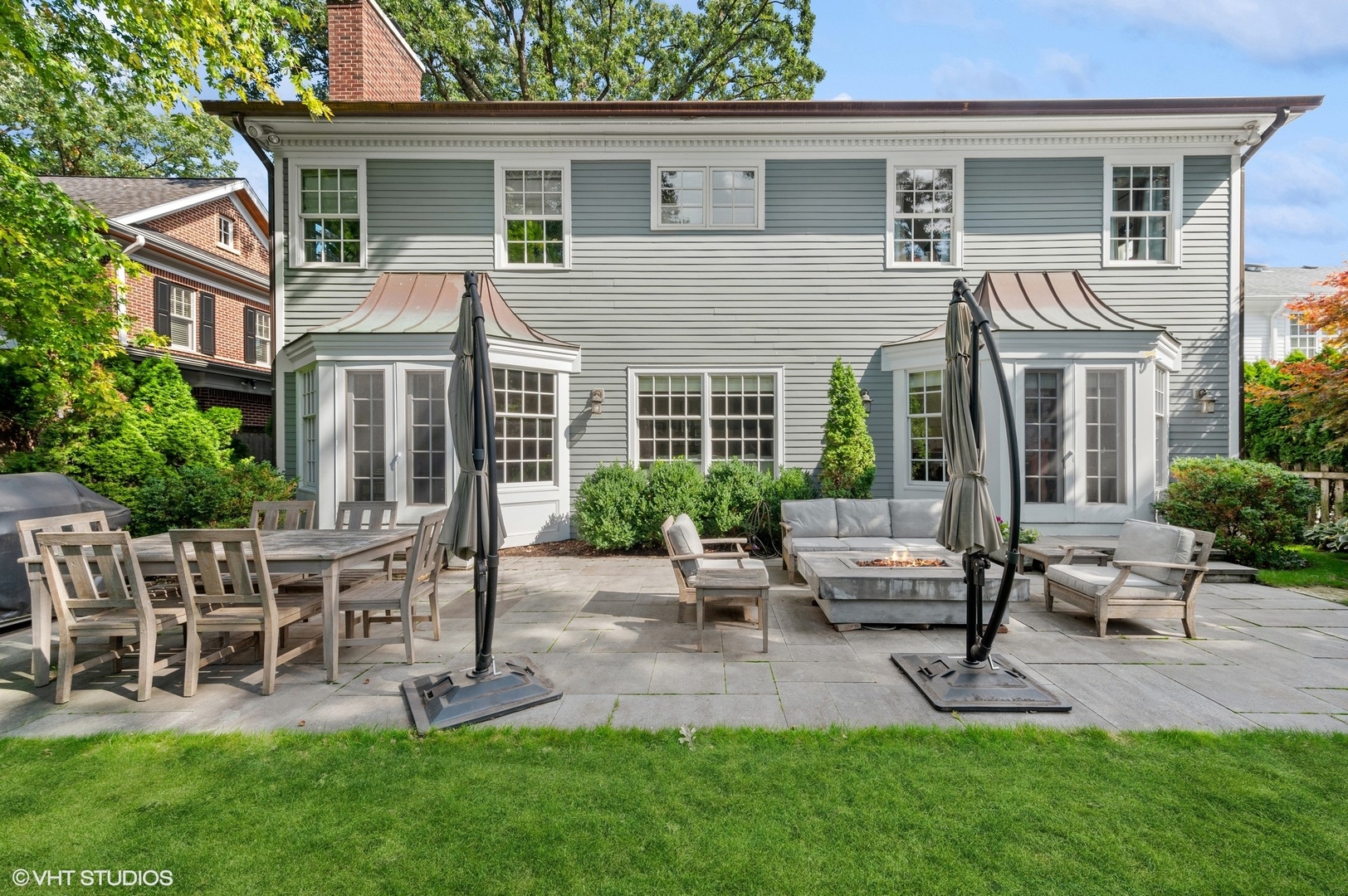 1047 Cherokee Road Wilmette, IL 60091 - Photo 28 of 36 a view of a house with a backyard and chairs