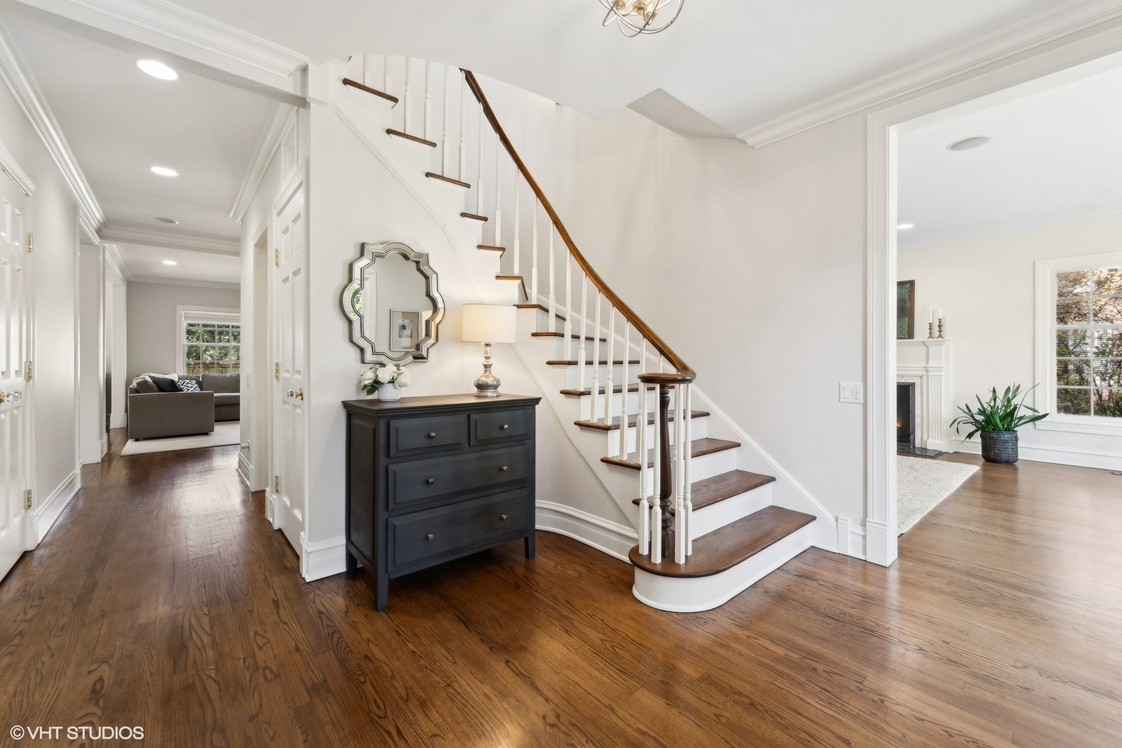 1047 Cherokee Road Wilmette, IL 60091 - Photo 3 of 36 a view of a hallway with stairs and wooden floor