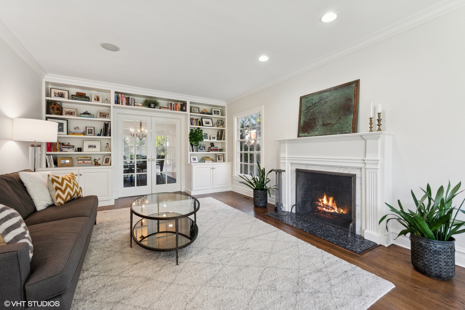 1047 Cherokee Road Wilmette, IL 60091 - Photo 6 of 36 a living room with furniture and a fireplace