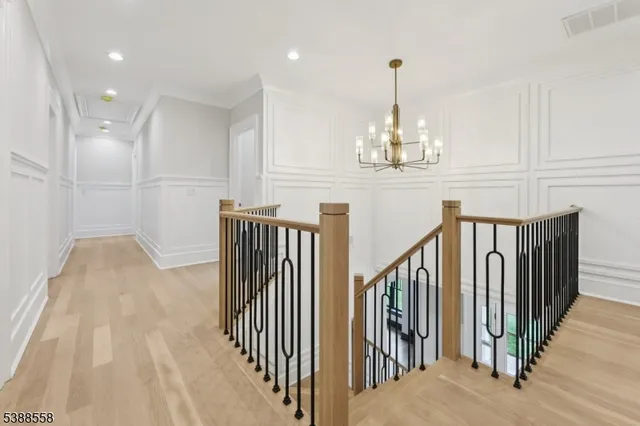 a view of a hallway with windows and entryway