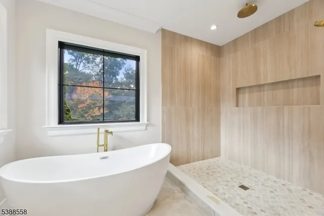 a bath tub sitting next to a window