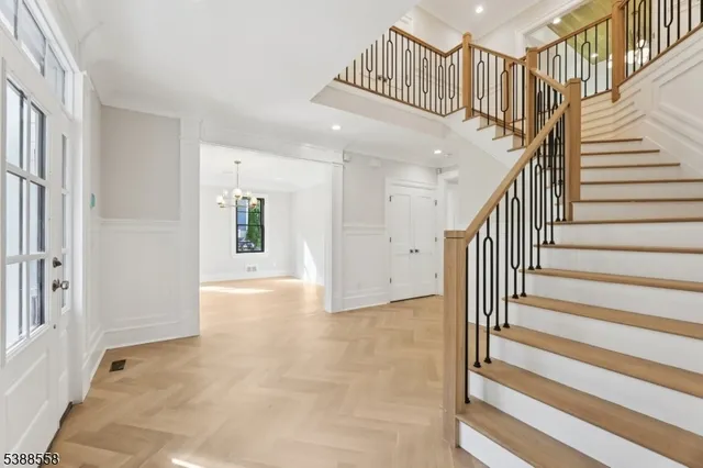 a view of staircase with white walls and windows