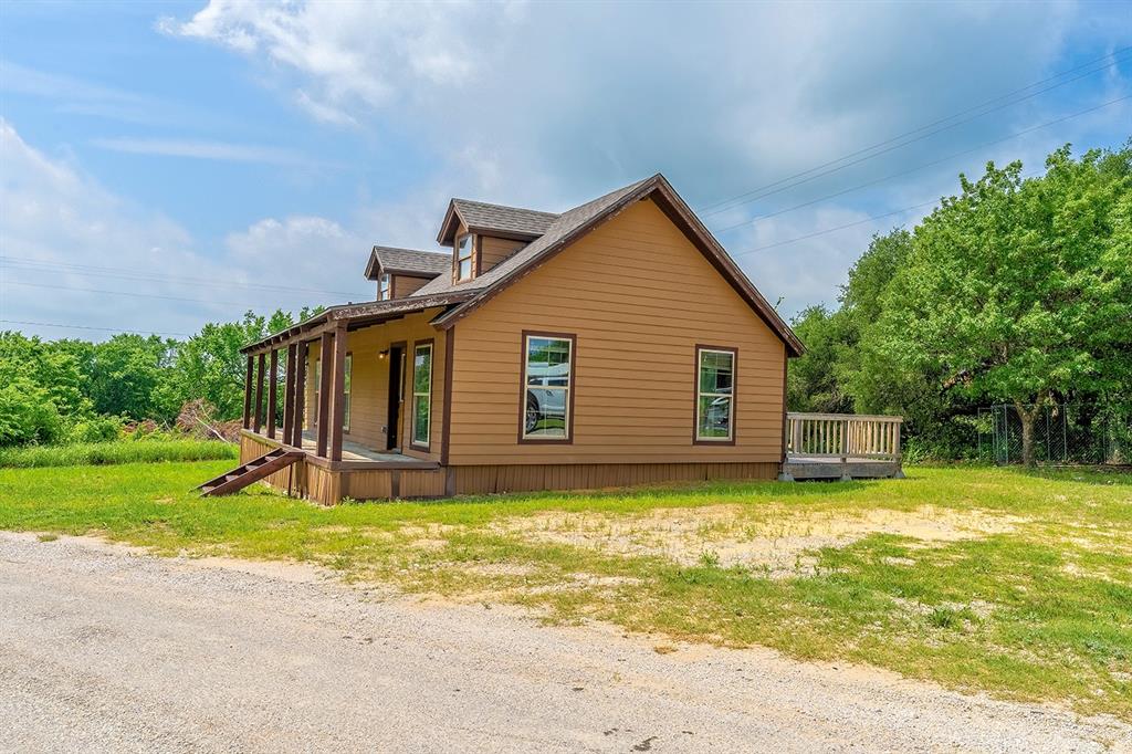 371 Spring Street Forestburg, TX 76239 - Photo 37 of 38 a view of a house with a yard and sitting area