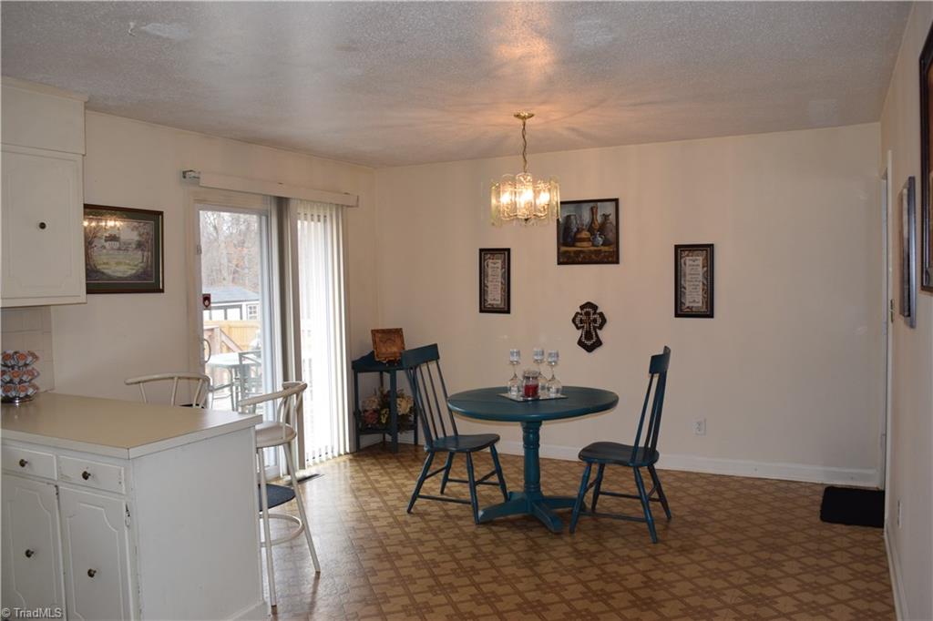 249 Deadmon Road Mocksville, NC 27028 - Photo 10 of 16 Roomy breakfast room attached to kitchen, sliding door to deck