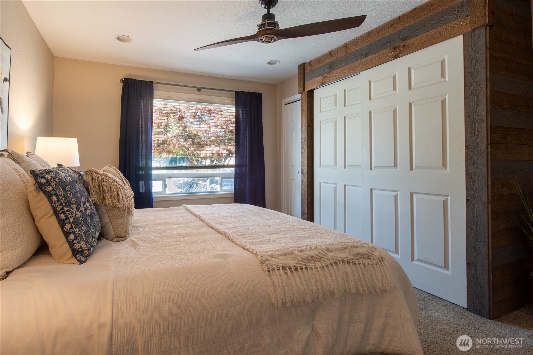 1610 16th Street Sumner, WA 98390 - Photo 11 of 28 a bedroom with a large bed and a window