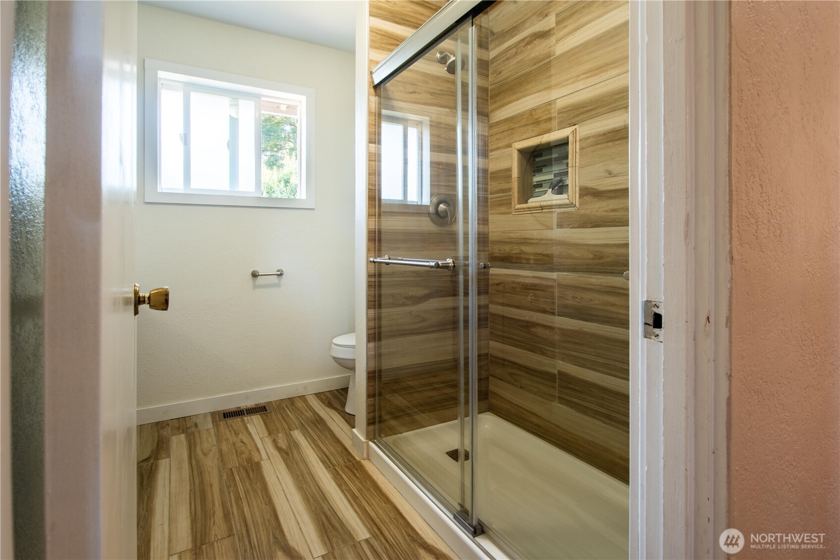 1610 16th Street Sumner, WA 98390 - Photo 16 of 28 a bathroom with a bathtub and shower
