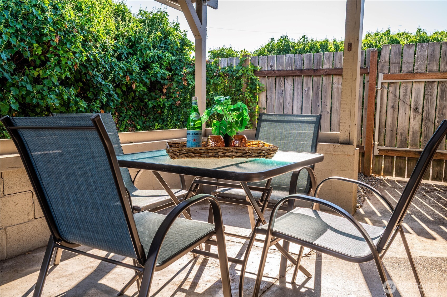 1610 16th Street Sumner, WA 98390 - Photo 19 of 28 a backyard of a house with table and chairs