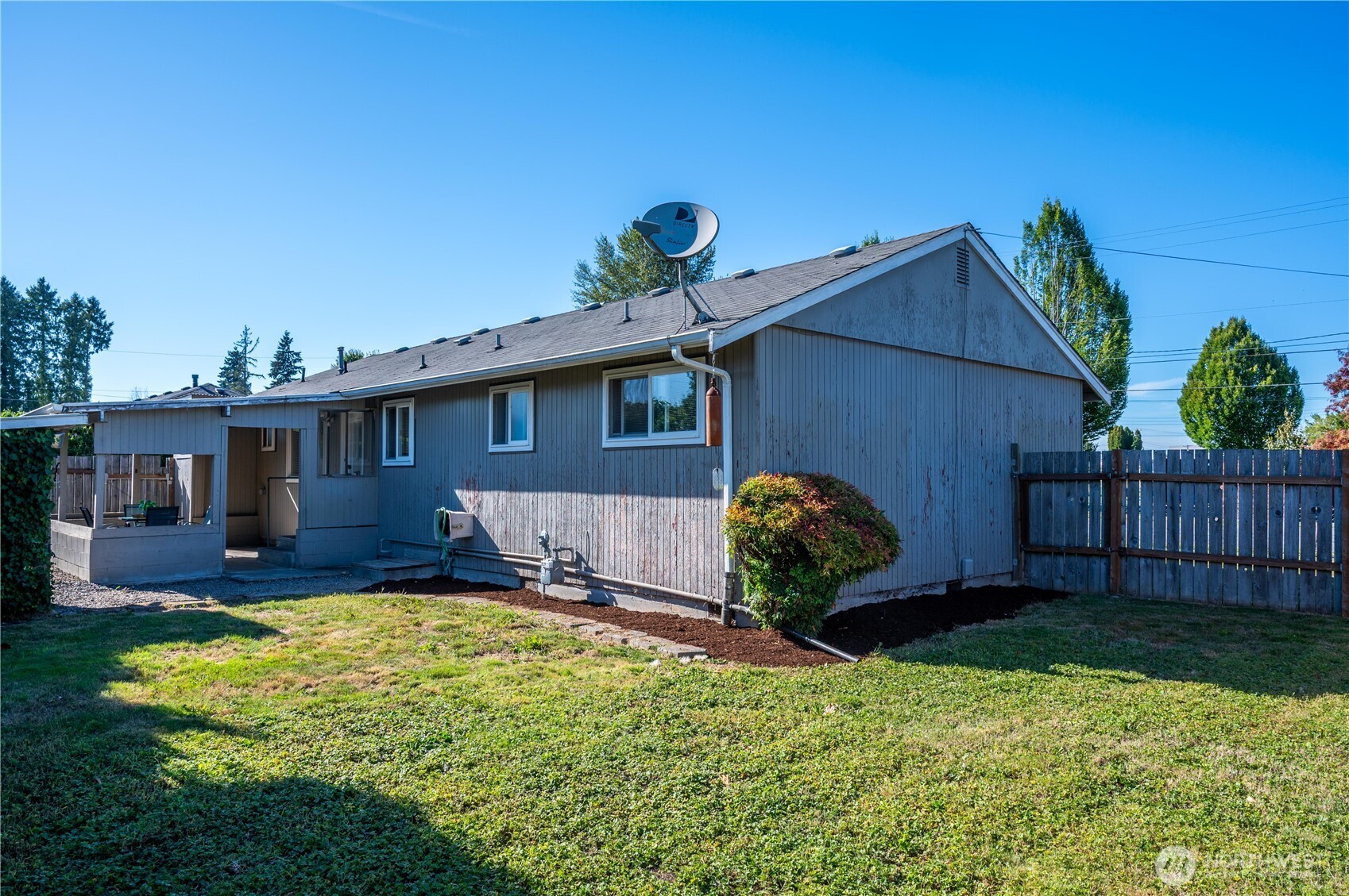 1610 16th Street Sumner, WA 98390 - Photo 22 of 28 a front view of a house with garden