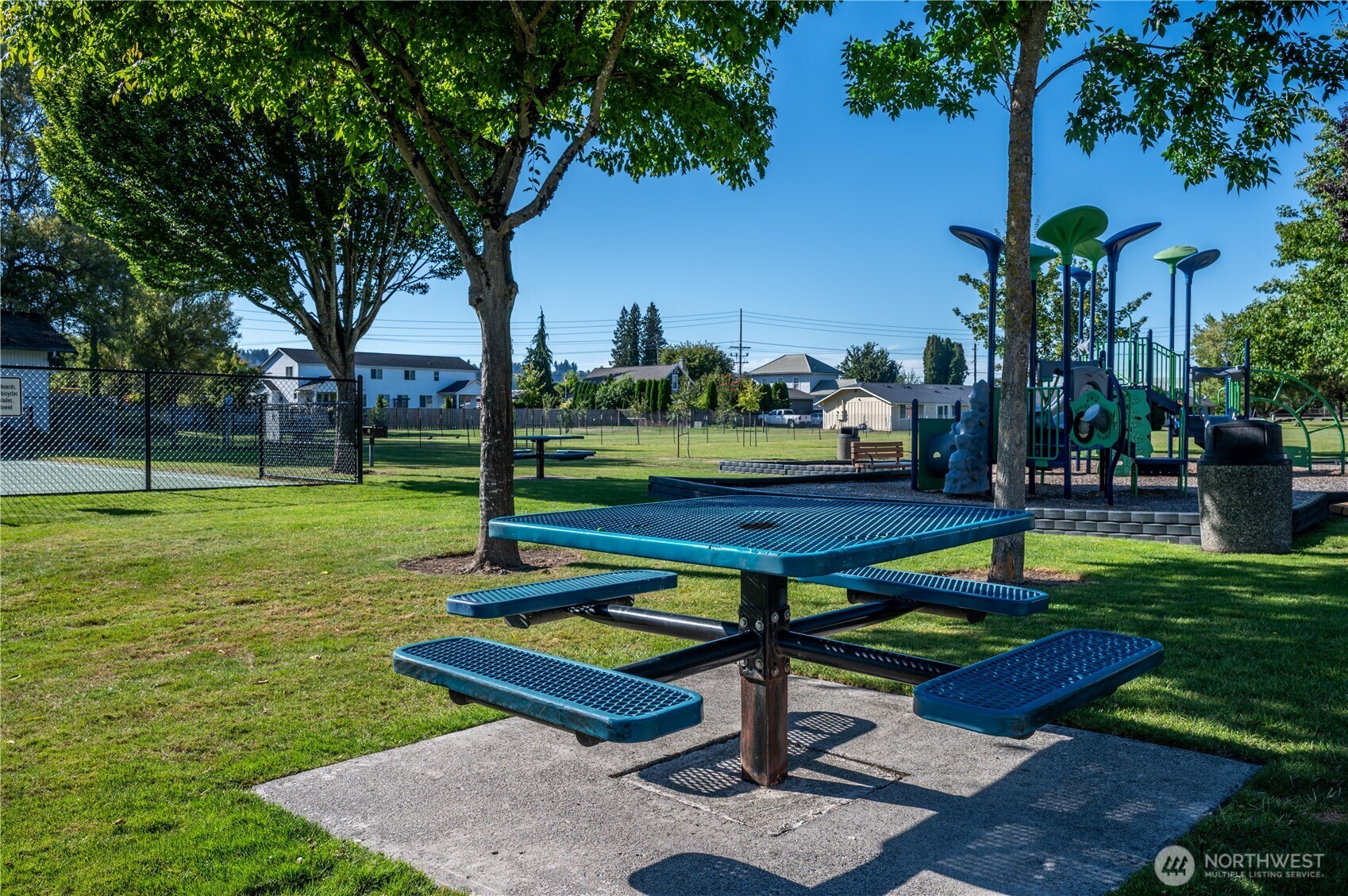 1610 16th Street Sumner, WA 98390 - Photo 25 of 28 a park view with a bench plants and trees