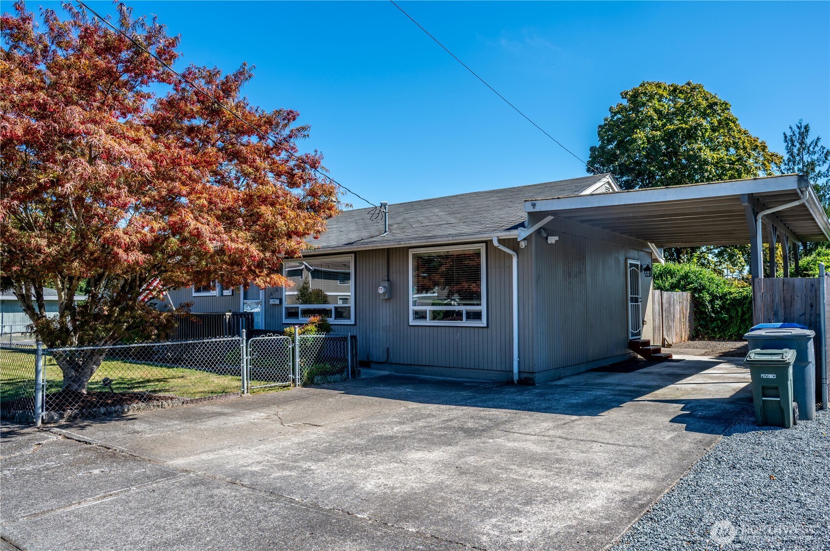 1610 16th Street Sumner, WA 98390 - Photo 3 of 28 a front view of a house with a yard