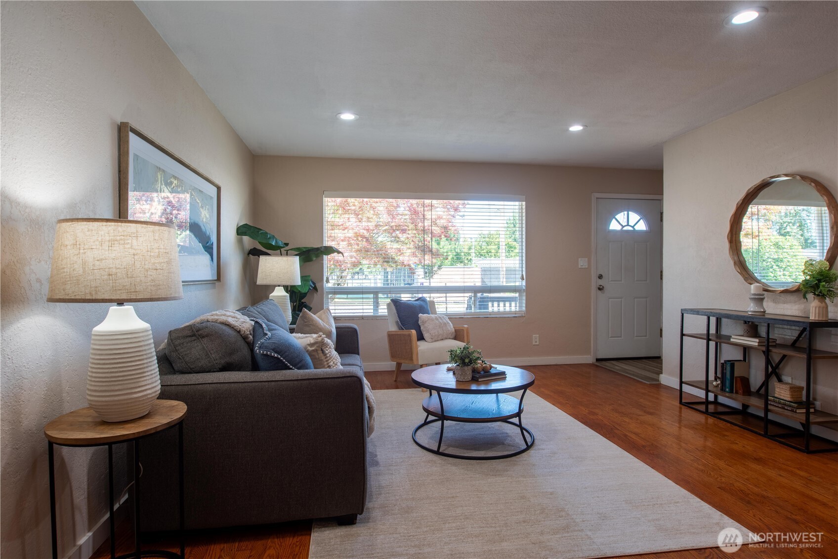 1610 16th Street Sumner, WA 98390 - Photo 5 of 28 a living room with furniture and a large window