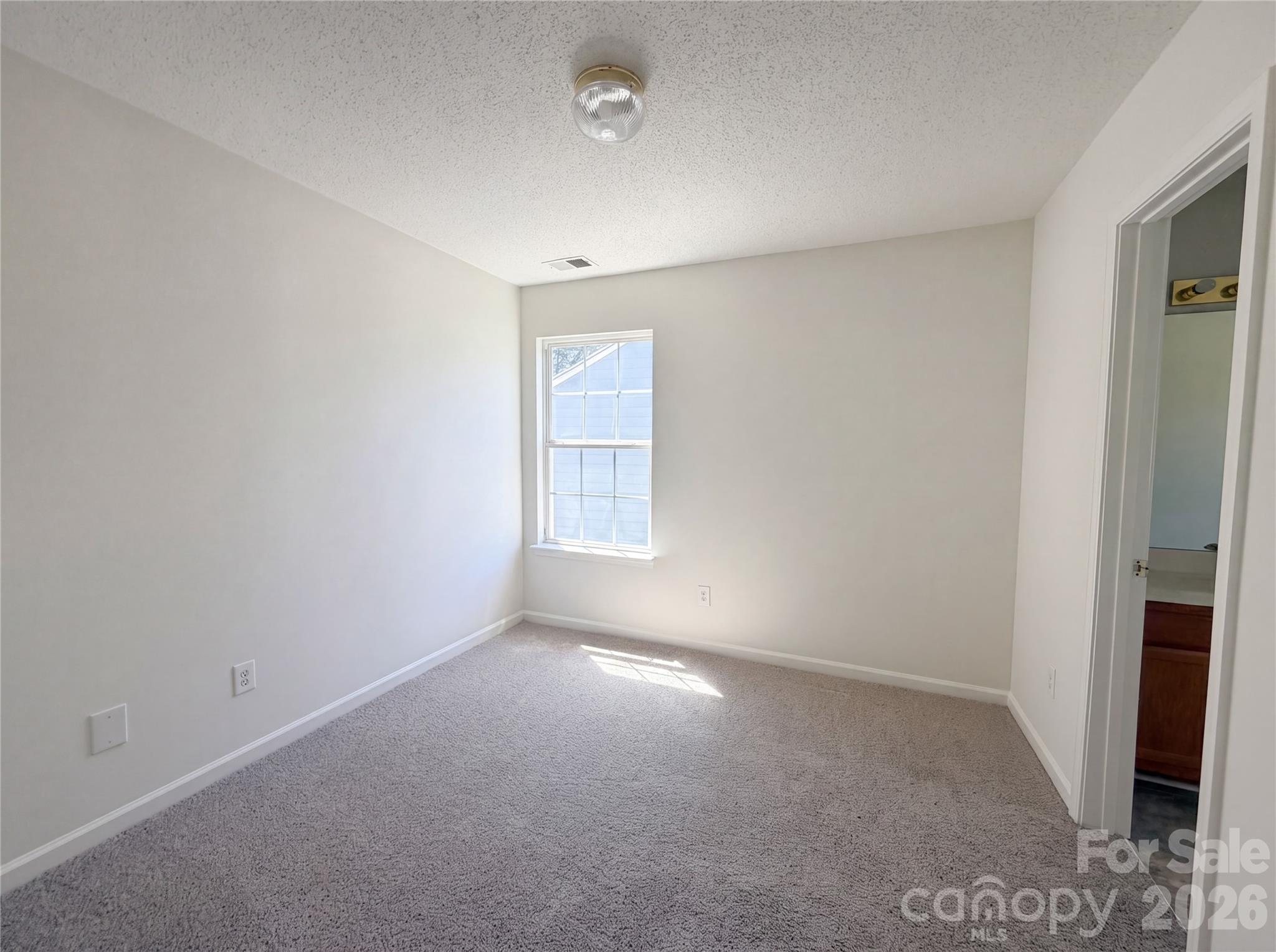 7423 Henderson Park Road Huntersville, NC 28078 - Photo 14 of 16 an empty room with windows and closet