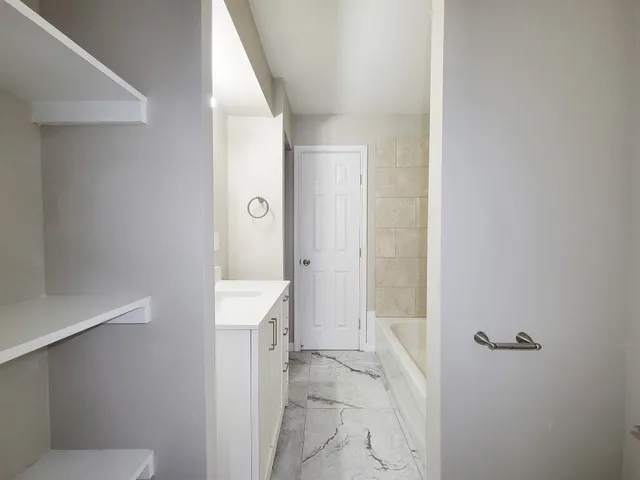 a bathroom with a sink and toilet