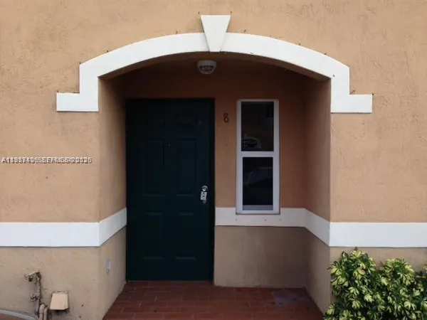 a front view of a house with a garage