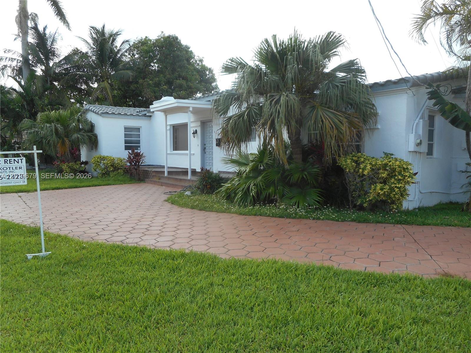 420 88th Street Surfside, FL 33154 - Photo 1 of 33 a view of a backyard with a garden