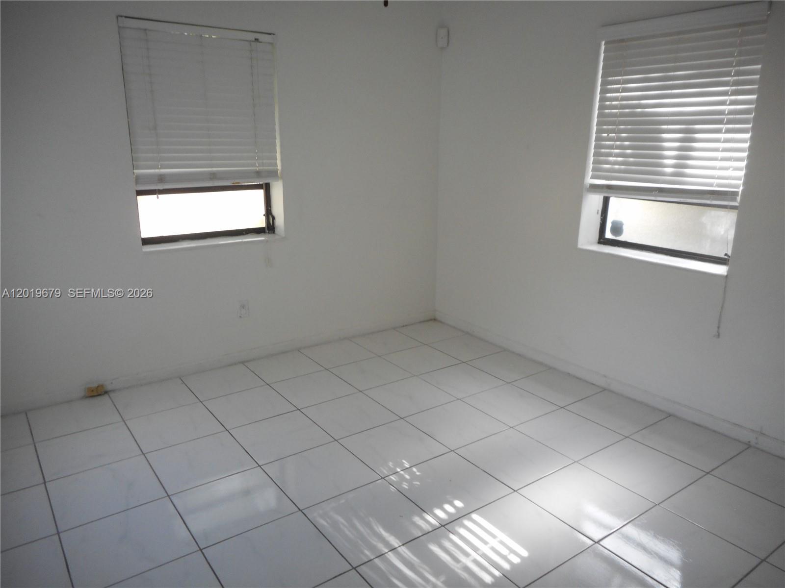 420 88th Street Surfside, FL 33154 - Photo 13 of 33 an empty room with windows