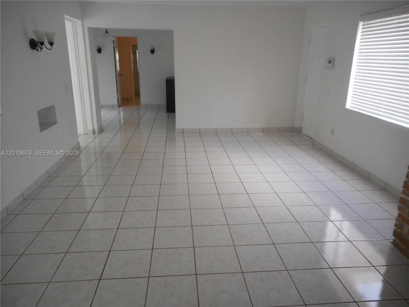 420 88th Street Surfside, FL 33154 - Photo 15 of 33 a view of an empty room and a window