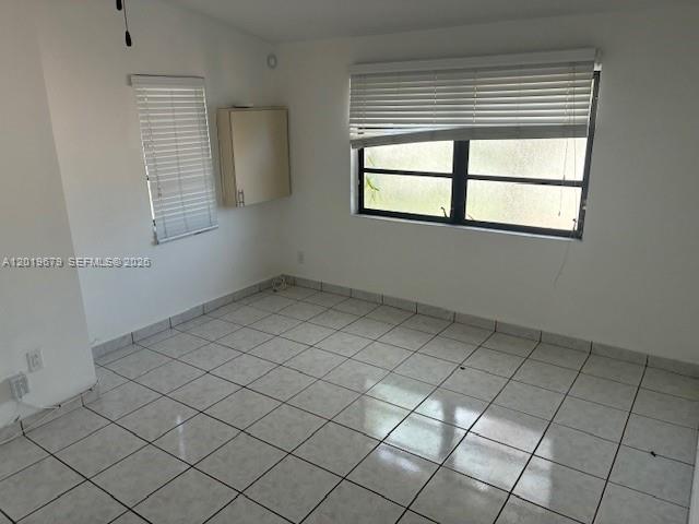 420 88th Street Surfside, FL 33154 - Photo 21 of 33 an empty room with windows