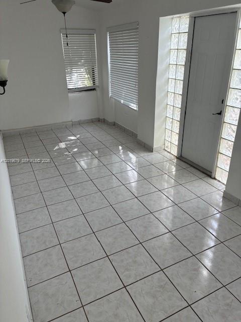 420 88th Street Surfside, FL 33154 - Photo 24 of 33 an empty room with windows and glass door