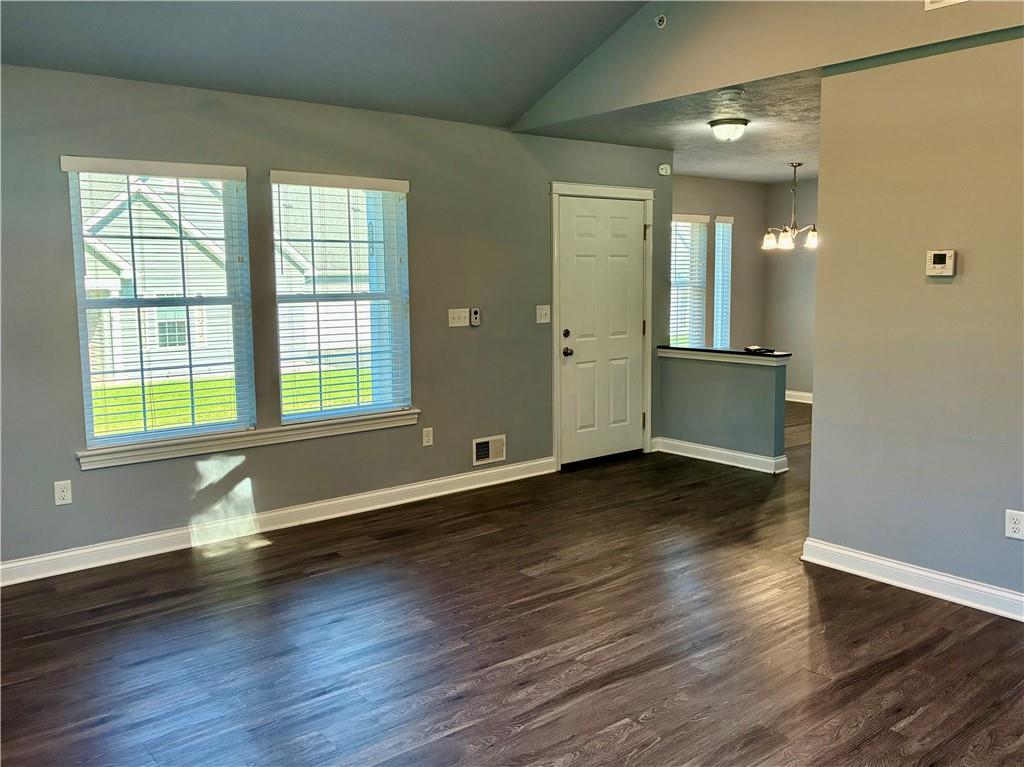 337 Kittery Ridge Drive, Unit A New Castle, PA 16101 - Photo 5 of 26 Looking back into the living room from the patio door. Quality hardwood laminate flooring throughout the main living area.