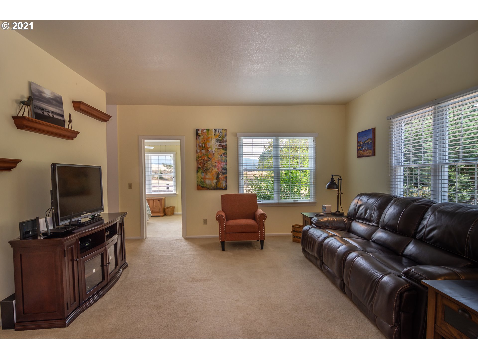 5852 Scotts Valley Road Yoncalla, OR 97499 - Photo 24 of 32 a living room with furniture and a flat screen tv