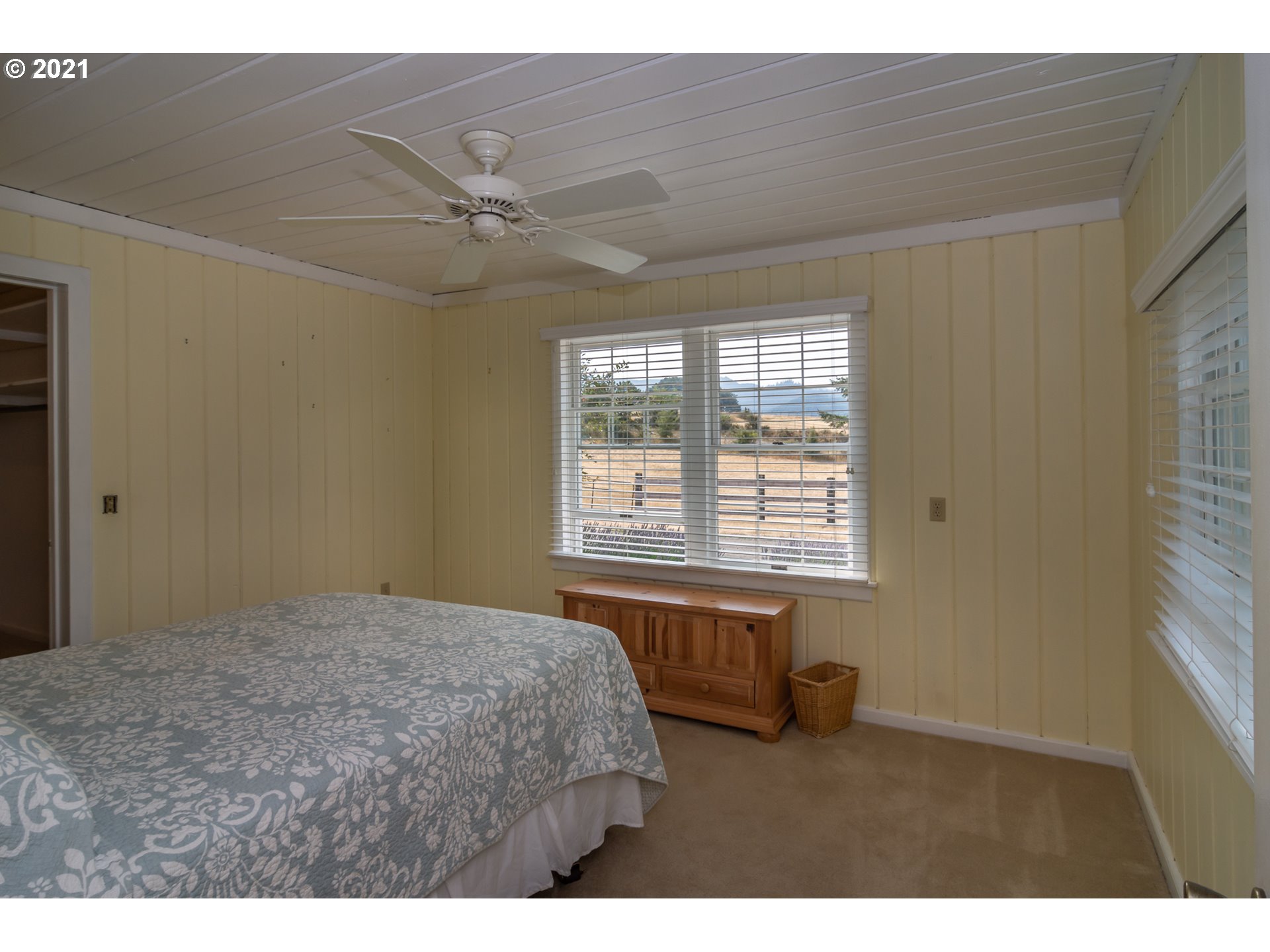 5852 Scotts Valley Road Yoncalla, OR 97499 - Photo 27 of 32 a bedroom with a bed and a window