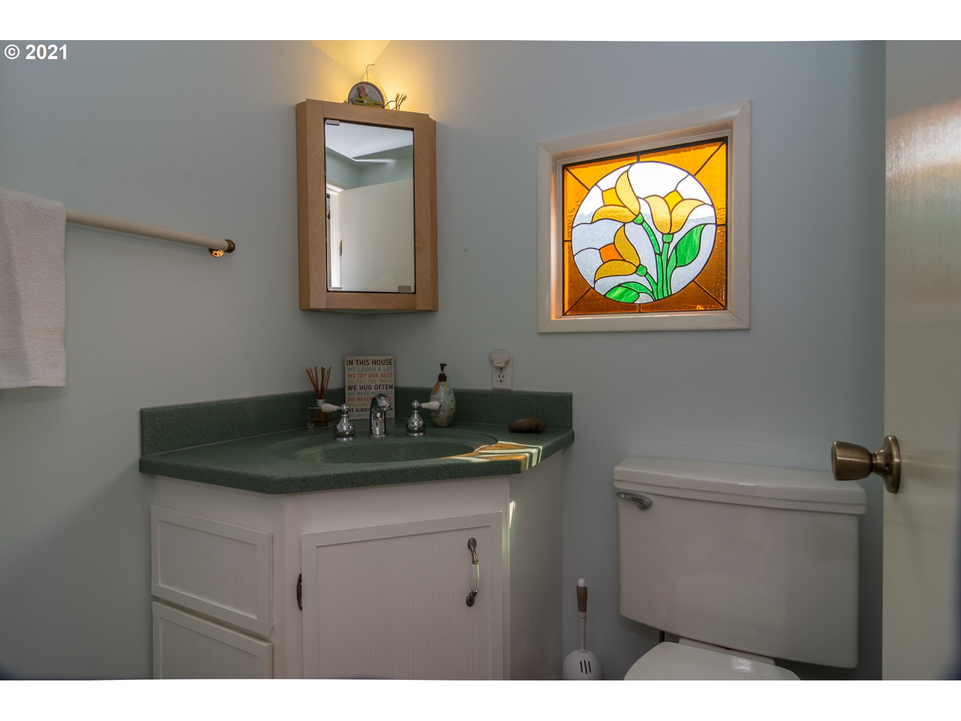 5852 Scotts Valley Road Yoncalla, OR 97499 - Photo 30 of 32 a bathroom with a sink and a mirror