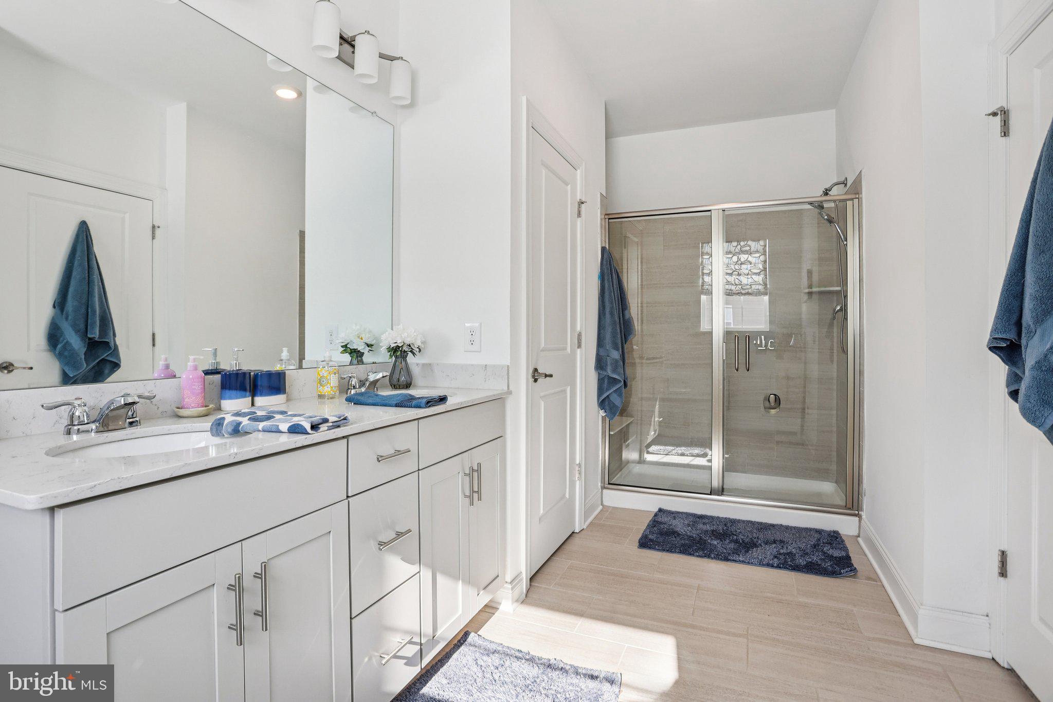 38 Tower Boulevard Mount Holly, NJ 08060 - Photo 26 of 42 a bathroom with a shower sink and mirror