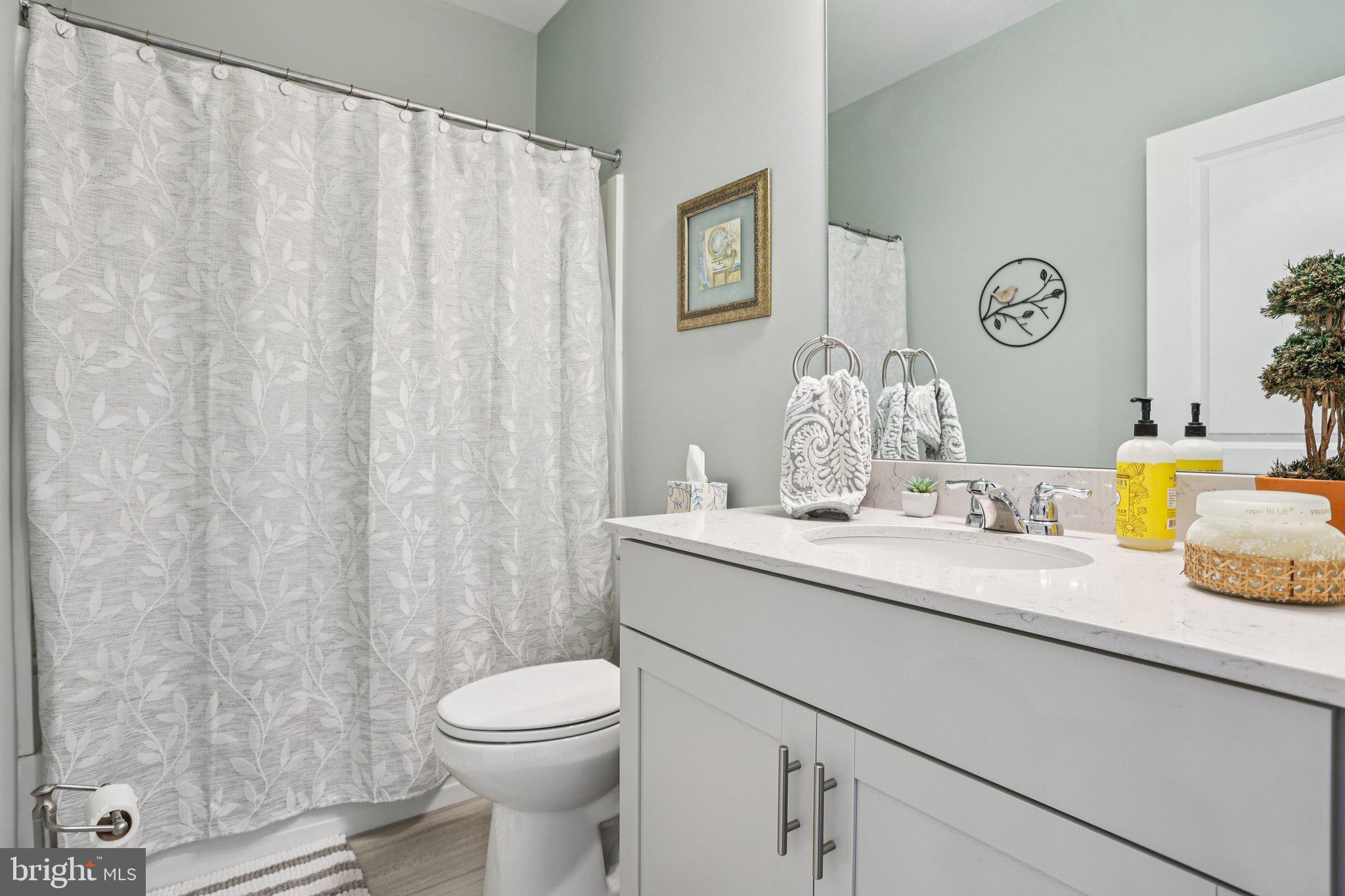 38 Tower Boulevard Mount Holly, NJ 08060 - Photo 30 of 42 a bathroom with a sink a toilet and a mirror