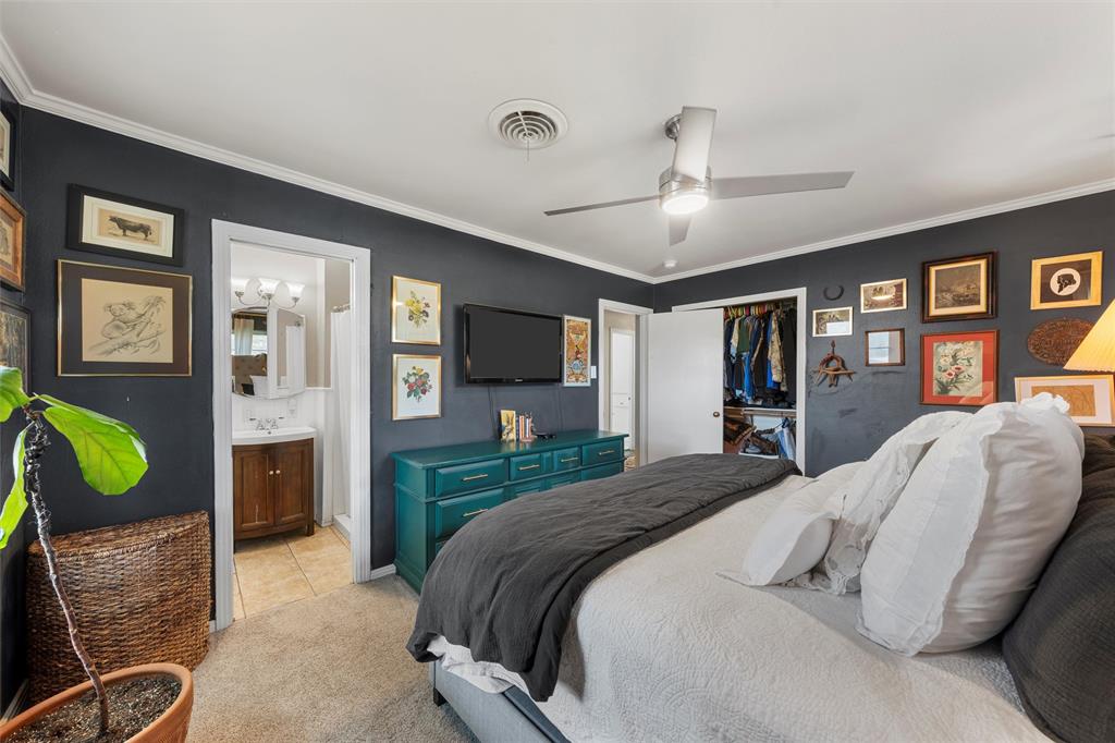 6224 Summit Ridge Drive Waco, TX 76710 - Photo 12 of 25 a spacious bedroom with a bed mirror and a dresser