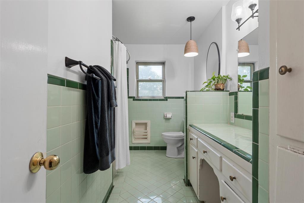 6224 Summit Ridge Drive Waco, TX 76710 - Photo 15 of 25 a kitchen with a refrigerator and a toilet