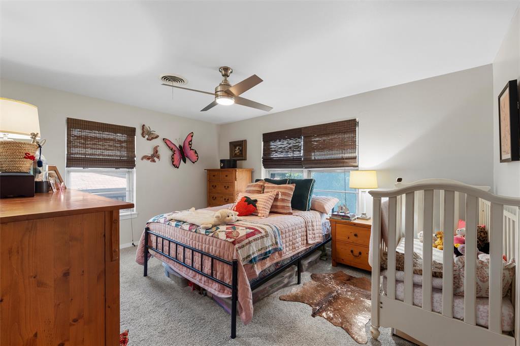 6224 Summit Ridge Drive Waco, TX 76710 - Photo 17 of 25 a bedroom that has a bed and a tv in it