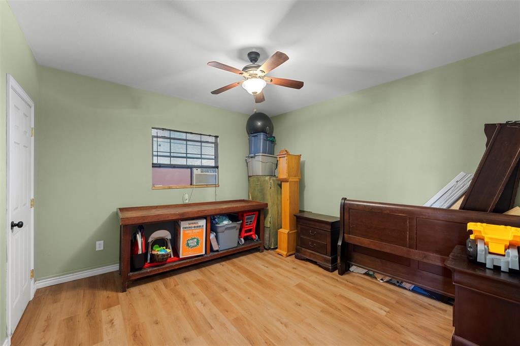 6224 Summit Ridge Drive Waco, TX 76710 - Photo 19 of 25 a living room with furniture and a fireplace